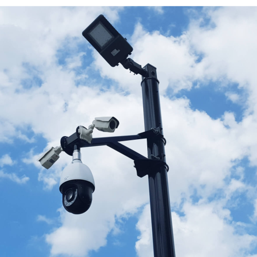 Steady Max pole with fence guard mount holding cameras and a light fixture.
